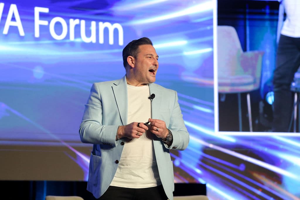 Justin Kabbani speaking to a forum audience