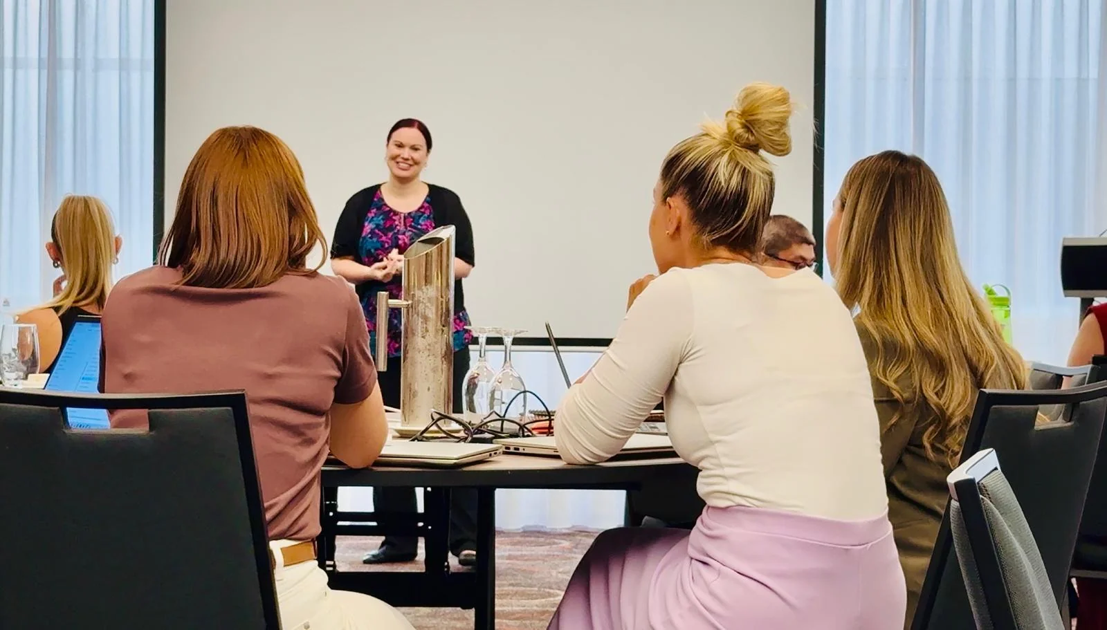 Jodee Bibaeff presenting an AI workshop to a corporate team